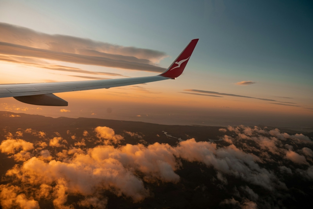 Plane taking off into the skies, showcasing the top airlines for business travel with premium services and comfort - Business First Travel Brisbane